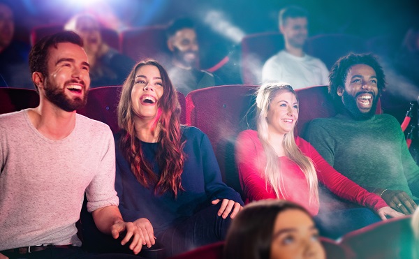 Friends enjoying film at cinema