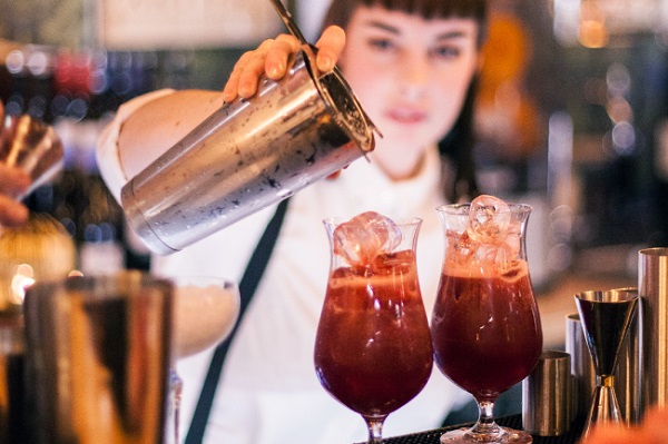 Woman making cocktails