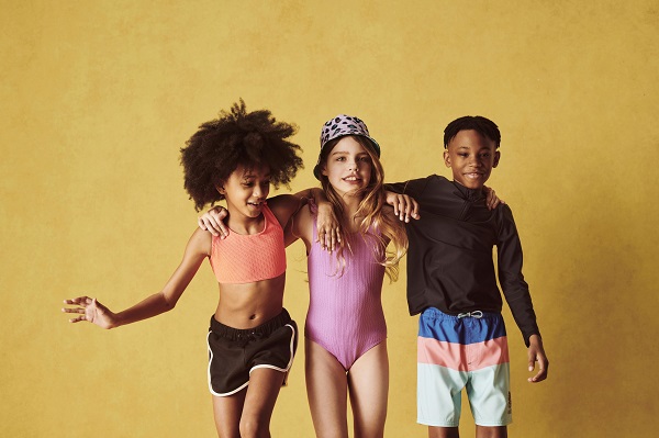 Three kids wearing swimwear